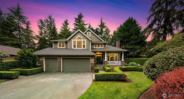 19852 NE 124th Pl, Woodinville, WA 98077 - view of front of home with a porch, concrete driveway, an attached garage, brick siding, and a chimney