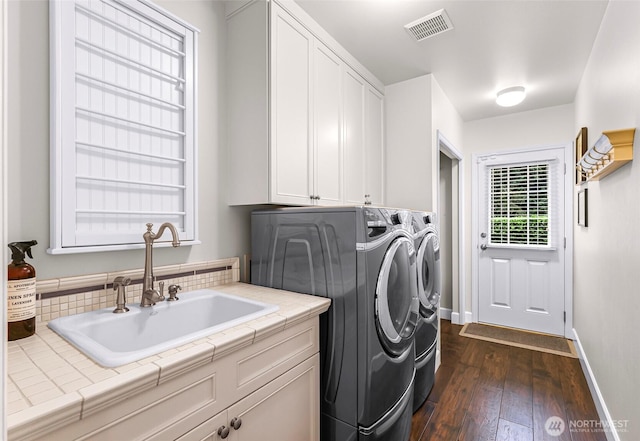 19852 NE 124th Pl, Woodinville, WA 98077 - laundry room with independent washer and dryer, cabinet space, dark wood-style flooring, and baseboards
