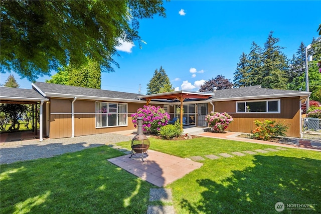 8422 E E St, Tacoma, WA 98445 - rear view of property with a yard, a patio, and a fire pit
