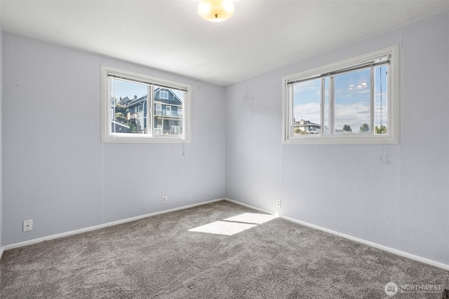 3510 N Puget Sound Ave, Tacoma, WA 98407 - spare room featuring healthy amount of natural light, carpet, and baseboards