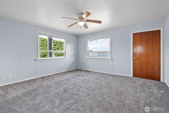 3510 N Puget Sound Ave, Tacoma, WA 98407 - spare room featuring carpet flooring, a ceiling fan, and baseboards