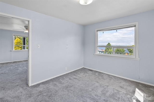 3510 N Puget Sound Ave, Tacoma, WA 98407 - empty room with carpet floors, baseboards, and a ceiling fan