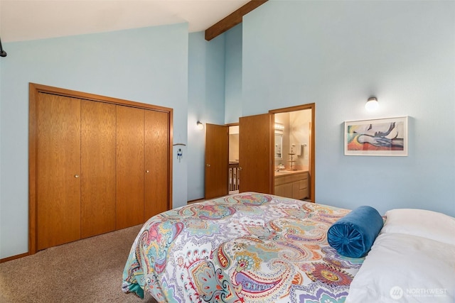 6206 SW Tiger Tail Dr, Olympia, WA 98512 - carpeted bedroom with high vaulted ceiling, beam ceiling, a closet, and ensuite bath