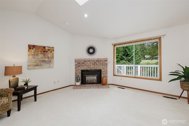 living area featuring carpet, vaulted ceiling, a fireplace, baseboards, and recessed lighting