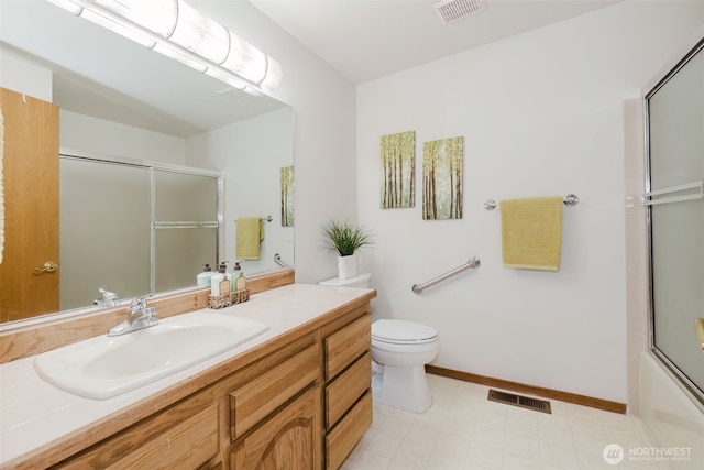 bathroom with toilet, baseboards, and vanity