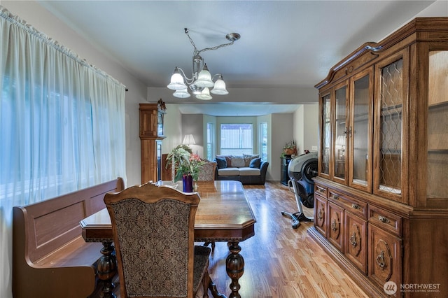 20282 NW Cedar Ln, Poulsbo, WA 98370 - dining room with a chandelier and light wood-style floors