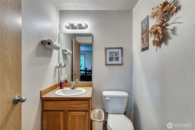20282 NW Cedar Ln, Poulsbo, WA 98370 - bathroom featuring toilet and vanity