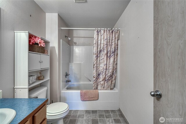 20282 NW Cedar Ln, Poulsbo, WA 98370 - bathroom featuring toilet, vanity, and shower / tub combo with curtain