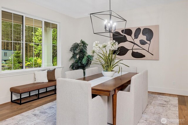 43268 SE 145th Pl, North Bend, WA 98045 - dining room featuring a chandelier, wood finished floors, and baseboards