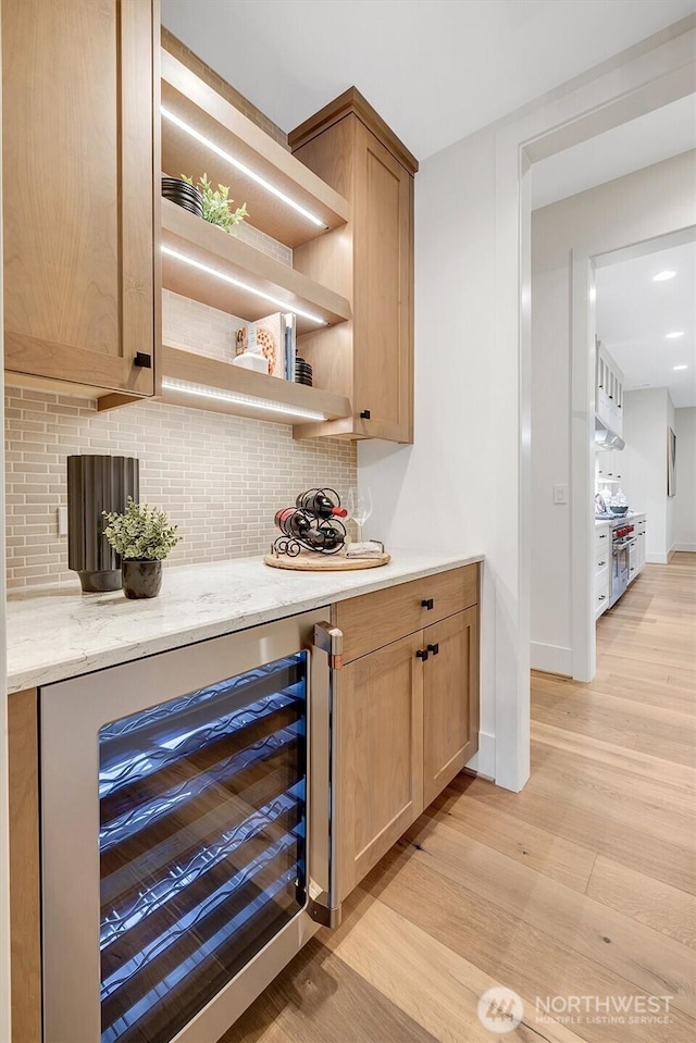 43268 SE 145th Pl, North Bend, WA 98045 - indoor dry bar with beverage cooler, light wood-style flooring, tasteful backsplash, and double oven range