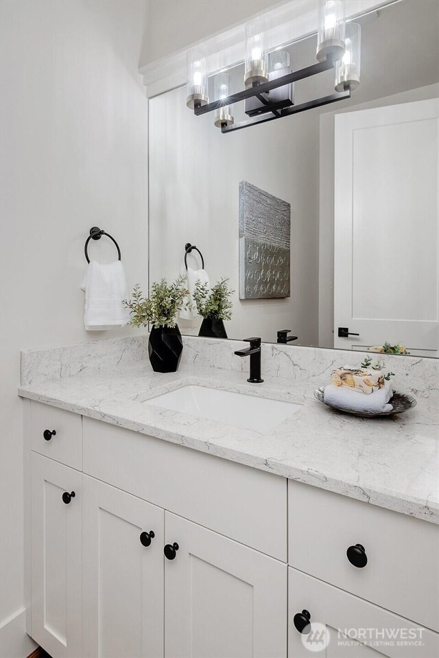43268 SE 145th Pl, North Bend, WA 98045 - bathroom with vanity and a chandelier