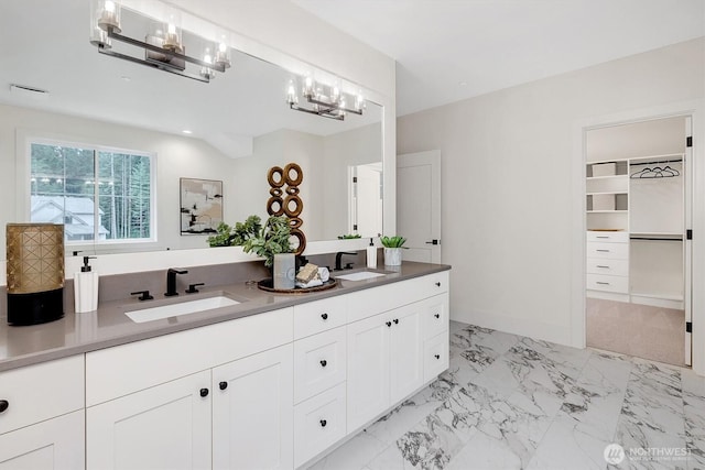 43268 SE 145th Pl, North Bend, WA 98045 - bathroom with a chandelier, double vanity, marble finish flooring, and a spacious closet