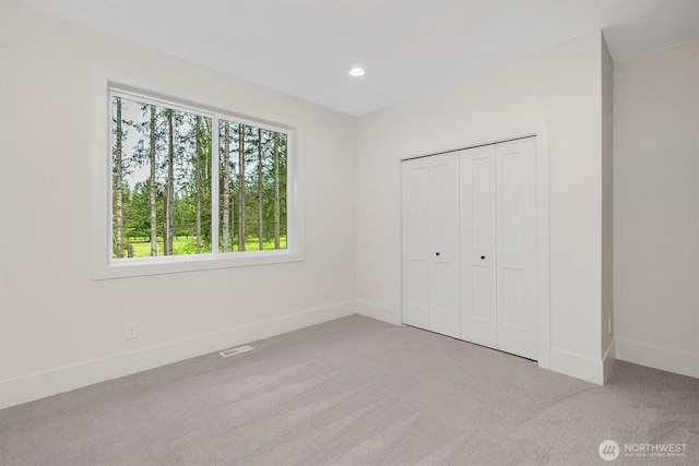 43268 SE 145th Pl, North Bend, WA 98045 - unfurnished bedroom with carpet, baseboards, recessed lighting, and a closet
