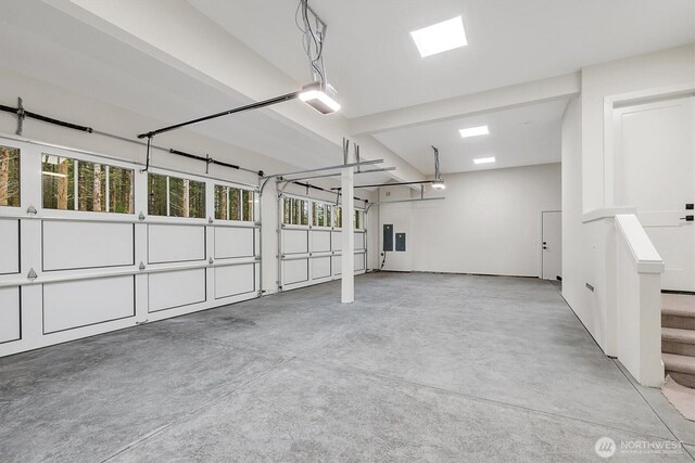 43268 SE 145th Pl, North Bend, WA 98045 - garage featuring a garage door opener and electric panel