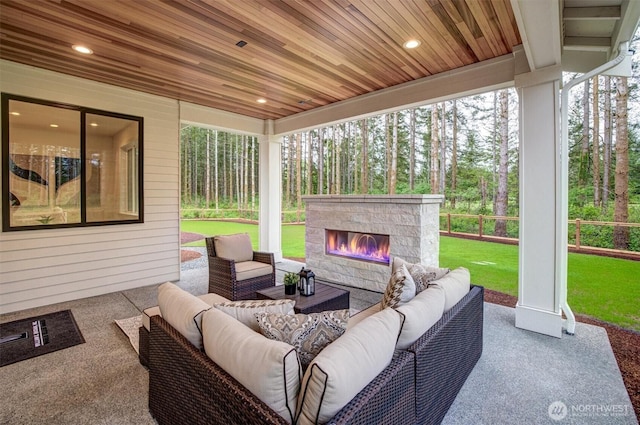 43268 SE 145th Pl, North Bend, WA 98045 - view of patio with an outdoor living space with a fireplace