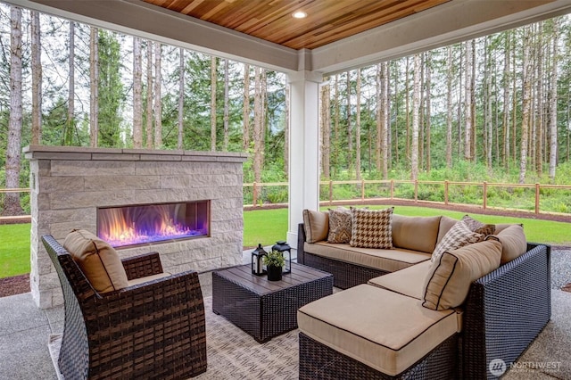 43268 SE 145th Pl, North Bend, WA 98045 - view of patio / terrace featuring an outdoor living space with a fireplace, fence, and a wooded view