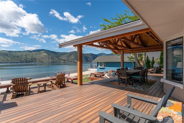34 Leisure Ln, Manson, WA 98831 - wooden deck featuring a water and mountain view and outdoor dining space