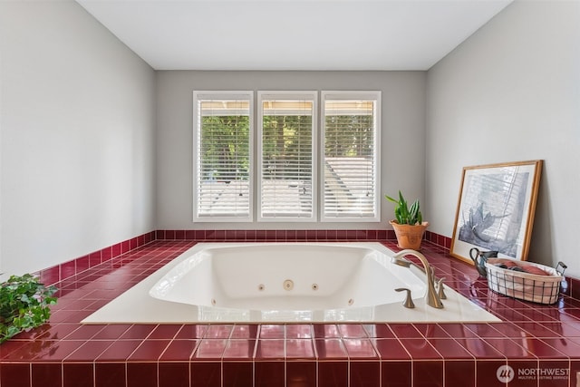 full bathroom with a tub with jets