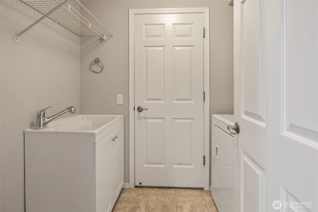 7521 Sterling Pl, Arlington, WA 98223 - laundry area featuring washer / clothes dryer, a sink, and light tile patterned flooring