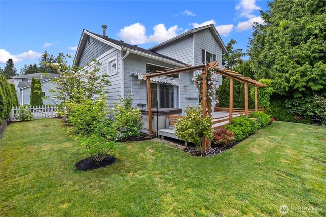 7521 Sterling Pl, Arlington, WA 98223 - back of property with a pergola, a hot tub, and a deck