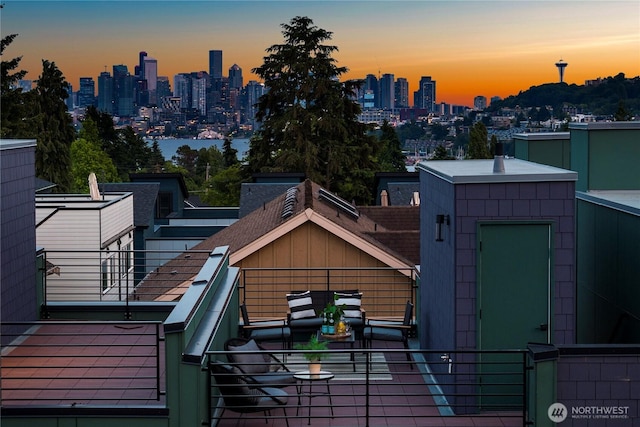 1523 N 39th St, Seattle, WA 98103 - balcony at dusk with a skyline view and an outdoor living space