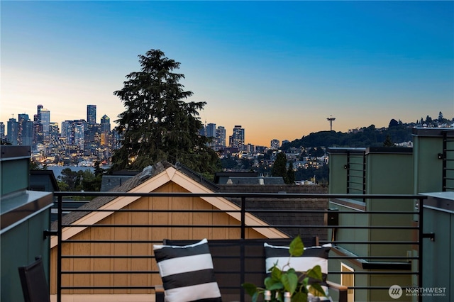 1523 N 39th St, Seattle, WA 98103 - balcony at dusk featuring a view of skyline