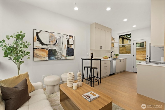 1523 N 39th St, Seattle, WA 98103 - living area with light wood-type flooring and recessed lighting