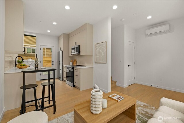 1523 N 39th St, Seattle, WA 98103 - living area with a wall unit AC, light wood-style flooring, and recessed lighting