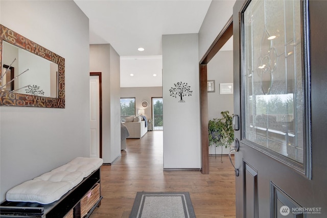 foyer entrance featuring wood finished floors, recessed lighting, and baseboards