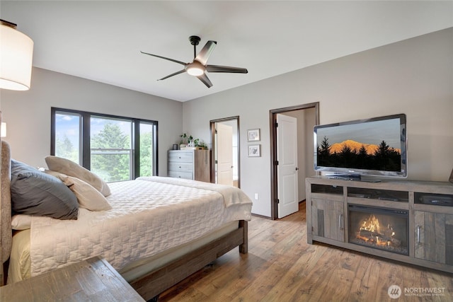 bedroom featuring wood finished floors and ceiling fan