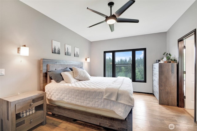 bedroom with light wood-style floors and ceiling fan