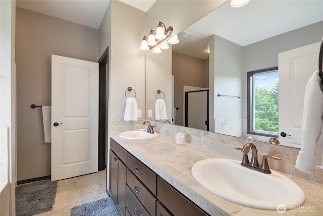 bathroom featuring a shower stall and double vanity