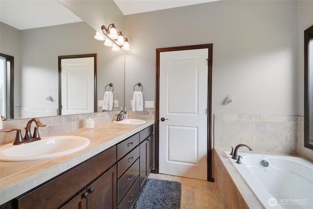 bathroom featuring double vanity, a garden tub, and tile patterned floors