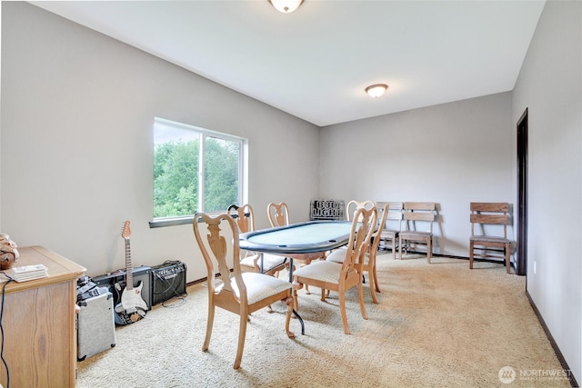 view of carpeted dining area