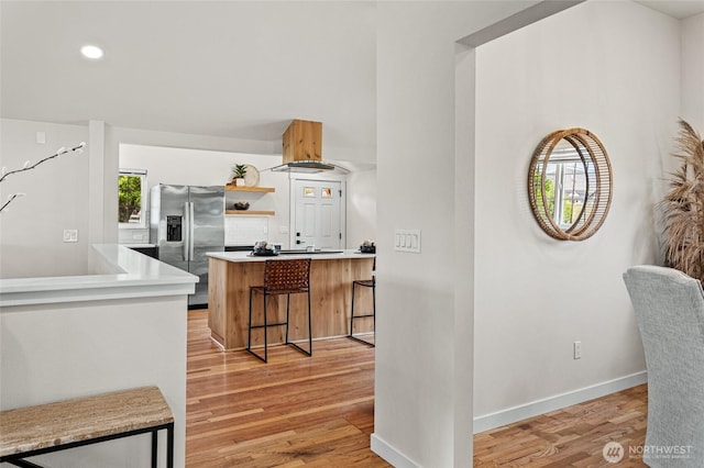 21 Hexon Rd, Selah, WA 98942 - kitchen featuring stainless steel fridge, light wood-type flooring, open shelves, light countertops, and a kitchen breakfast bar