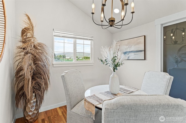 21 Hexon Rd, Selah, WA 98942 - dining area featuring a chandelier, lofted ceiling, wood finished floors, and baseboards