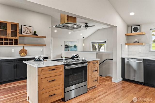 21 Hexon Rd, Selah, WA 98942 - kitchen with stainless steel appliances, open shelves, lofted ceiling, decorative backsplash, and light countertops