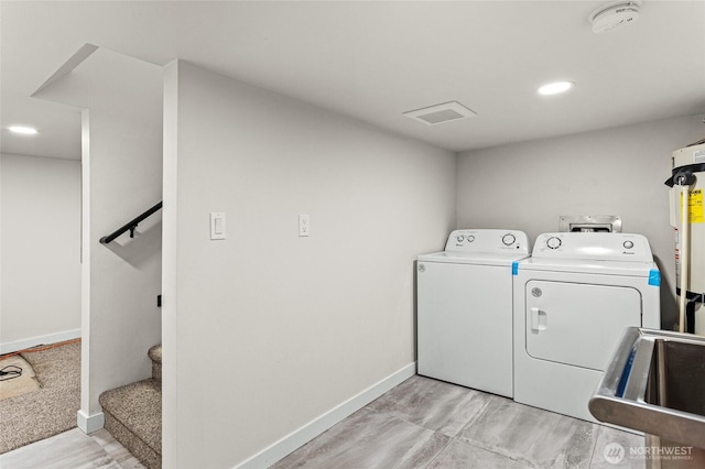 21 Hexon Rd, Selah, WA 98942 - laundry area featuring separate washer and dryer, baseboards, a sink, water heater, and recessed lighting
