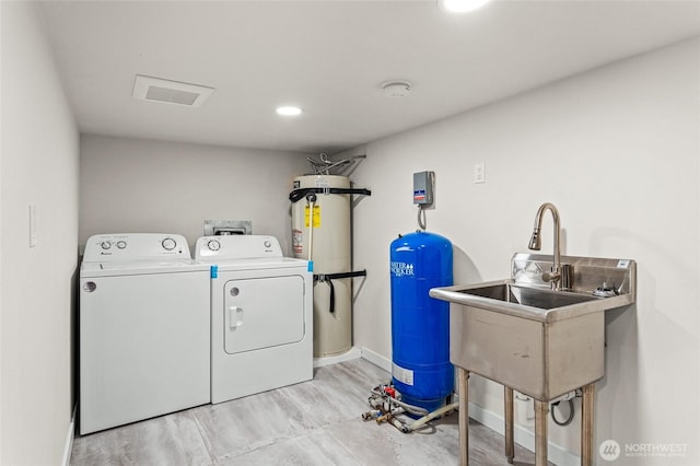 21 Hexon Rd, Selah, WA 98942 - laundry room featuring water heater, separate washer and dryer, and baseboards
