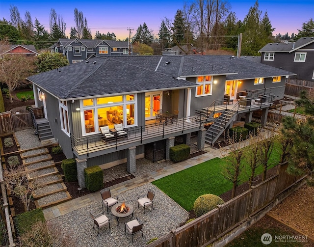 2249 78th Ave SE, Mercer Island, WA 98040 - rear view of house featuring stairs, an outdoor fire pit, a wooden deck, a shingled roof, and a fenced backyard