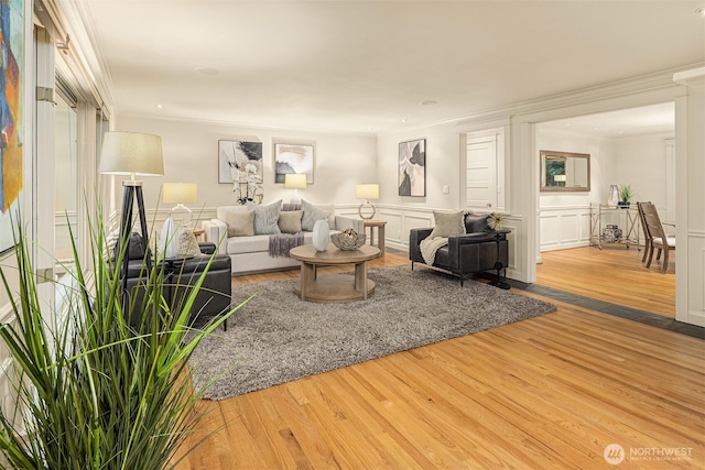 2249 78th Ave SE, Mercer Island, WA 98040 - living room featuring wood finished floors, crown molding, and wainscoting