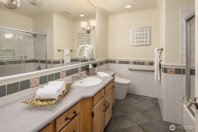 2249 78th Ave SE, Mercer Island, WA 98040 - full bathroom featuring a shower with shower door, ornamental molding, vanity, toilet, and tile walls