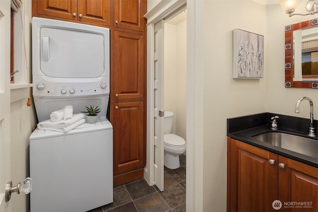 2249 78th Ave SE, Mercer Island, WA 98040 - bathroom featuring stacked washer / drying machine, toilet, and vanity