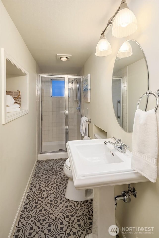 2249 78th Ave SE, Mercer Island, WA 98040 - full bath with a stall shower, toilet, baseboards, and tile patterned floors