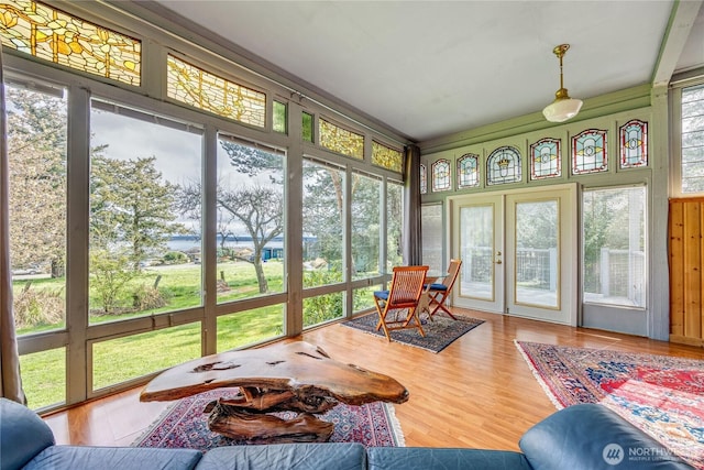 sunroom featuring french doors and wood finished floors