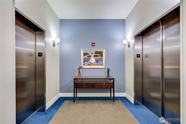 400 Washington Ave Unit 415, Bremerton, WA 98337 - hallway featuring elevator, carpet flooring, and baseboards