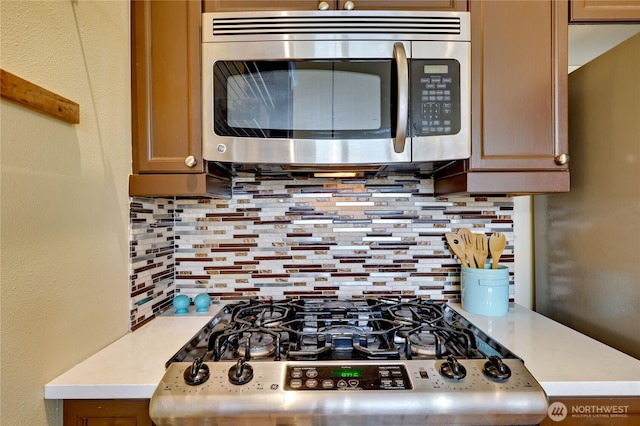 400 Washington Ave Unit 415, Bremerton, WA 98337 - kitchen featuring stainless steel appliances, tasteful backsplash, and light countertops