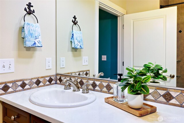 400 Washington Ave Unit 415, Bremerton, WA 98337 - bathroom featuring vanity and tasteful backsplash