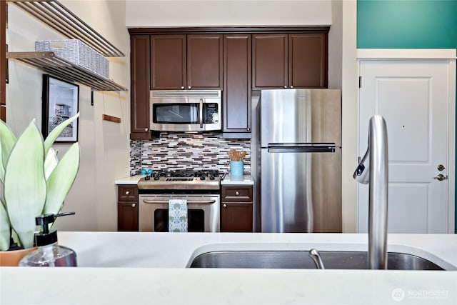 400 Washington Ave Unit 415, Bremerton, WA 98337 - kitchen with appliances with stainless steel finishes, dark brown cabinets, and light countertops