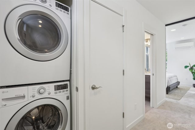 laundry room with stacked washer / dryer, an AC wall unit, light colored carpet, baseboards, and recessed lighting